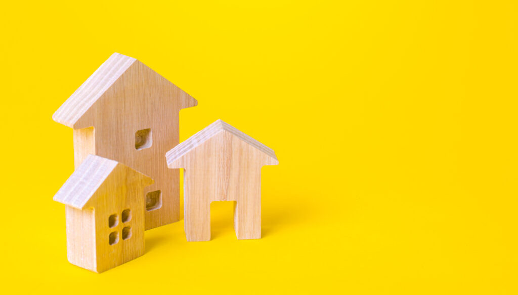 Residential buildings on a yellow background. Buying and selling real estate. Renting housing, Real Estate Agent services. Renovation and home improvement. Mortgage loan. Building maintenance.
