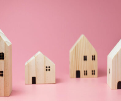 Mini residential craft house on a pink background